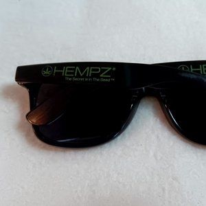 Hempz advertising sunglasses black w/ green lettering